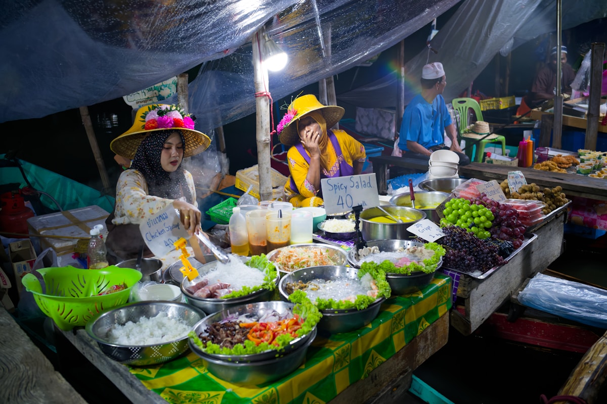Spread of Malaysian dishes including rendang, vegetables, and rice at a KL restaurant