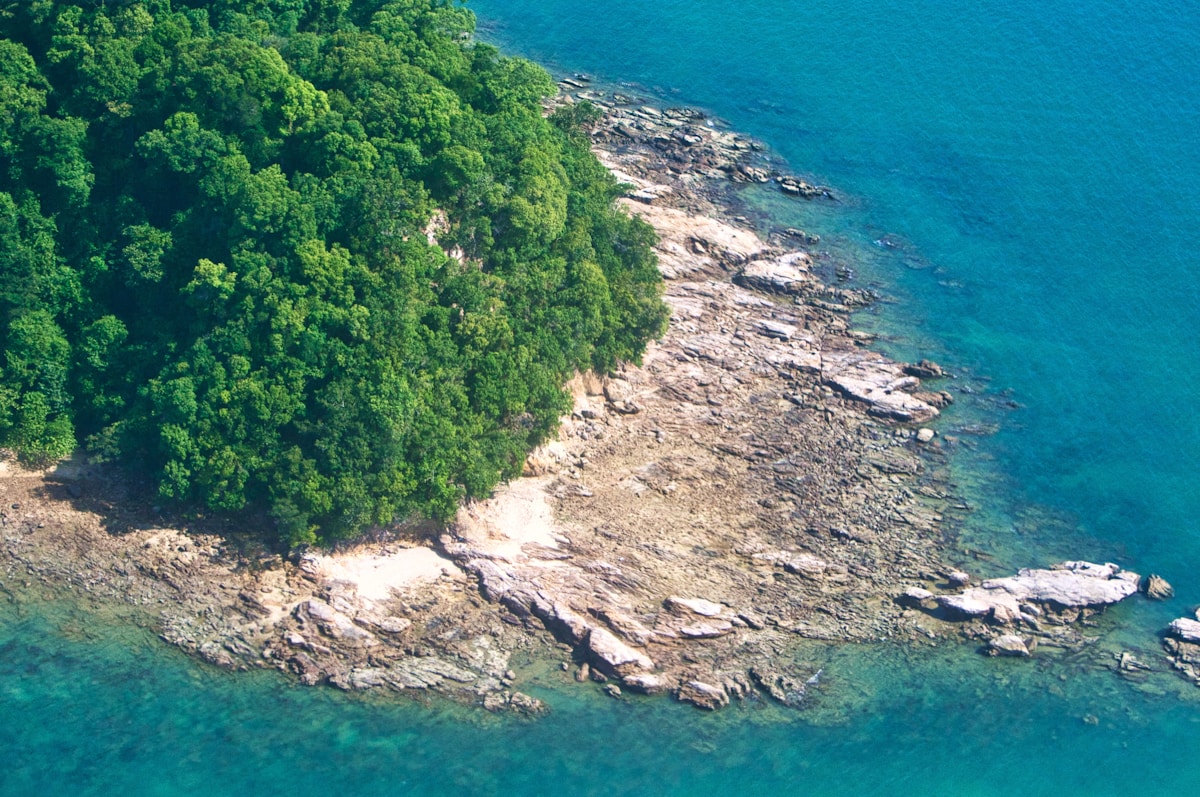 Clear shallow water and white sand at Tanjung Rhu beach, Langkawi