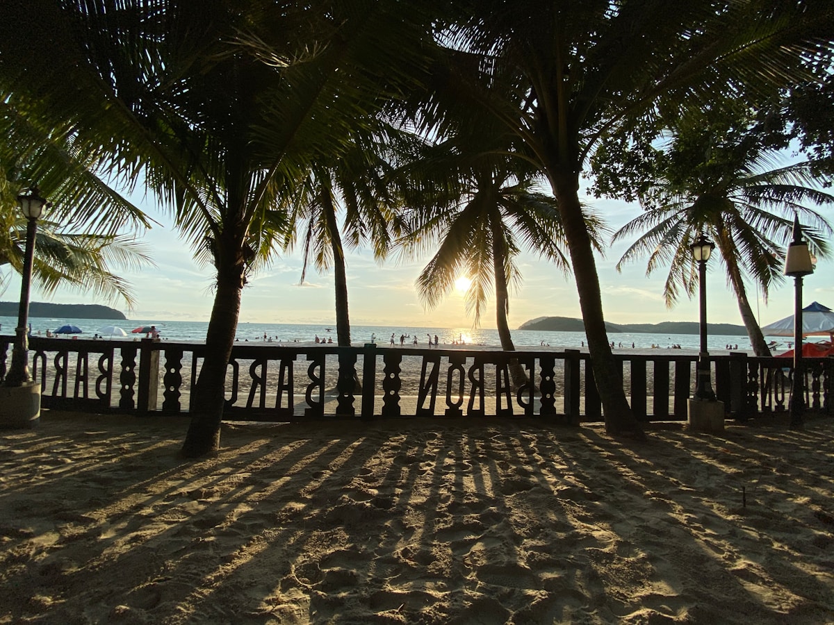 People walking on beach in Langkawi, Malaysia
