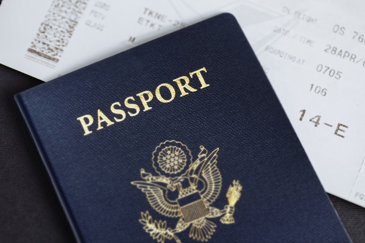 Passport with Malaysia entry stamp and travel documents