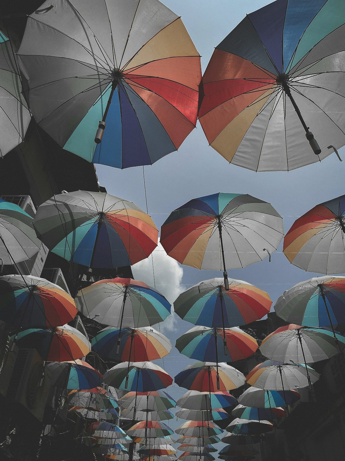 Rainbow-coloured umbrellas over Georgetown Heritage Site, Penang, Malaysia in April